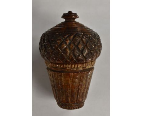 A 19th century coquilla nut sewing companion, engine turned as an acorn, screw-fitting cover enclosing provision for thimbles