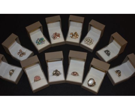 Rings -  a cultured pearl cluster ring; others creamy white, pink, turquoise green, etc;  a pink glass coral effect floral cl