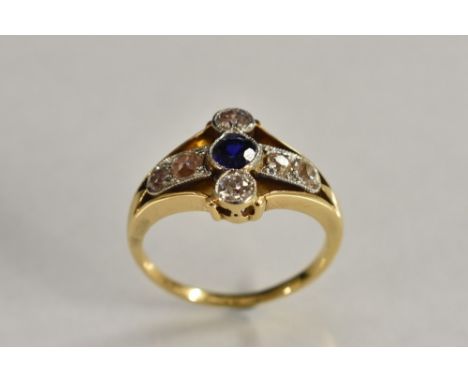 A diamond and sapphire cluster ring, central deep blue sapphire, surrounded by an open setting of six round old cut diamonds 