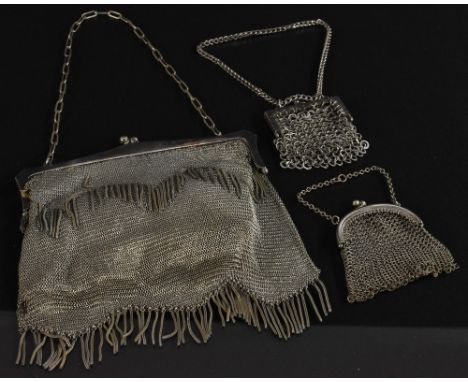 An Art Deco silver plated mesh purse, fringe detail, kid leather lined; two others smaller 