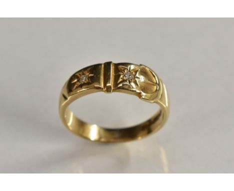 A two stone buckle ring, moulded belt buckle shank inset with two individually mounted round cut diamonds/white sapphires, 9c