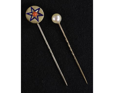 An early 20th century enamelled coral set six point star stick pin, unmarked yellow metal head, spiralled pin;  another cultu