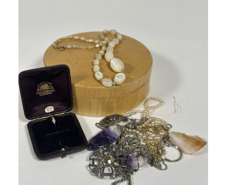 A collection of costume jewellery including two Amethyst rock crystal pendants on chains, graduated stand of moon stone beads