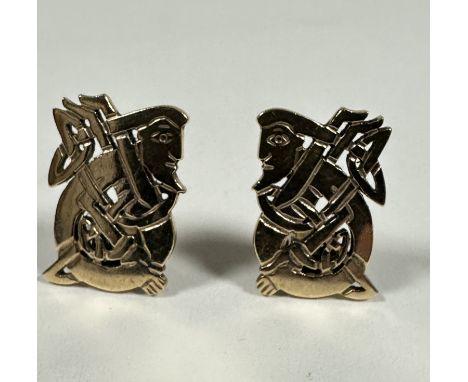 A pair of 9ct gold rectangular Celtic style figure earrings with clip fastenings, (H x 2cm x W x 1cm). 8.78g