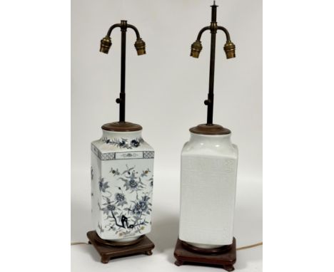 A white ceramic table lamp decorated with Chinese letters to body raised on a wooden base (small chip to wooden base) (h-63cm