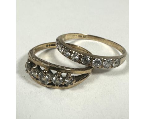 A 9ct gold ring set five graduated clear stones, J and a 9ct gold half eternity style ring set nine clear stones, P. (2) 2.98