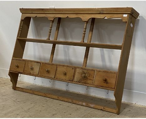 A Victorian style pine delf rack, with two open shelves above six spice drawers and two rows of brass hooks H110cm, W161cm, D