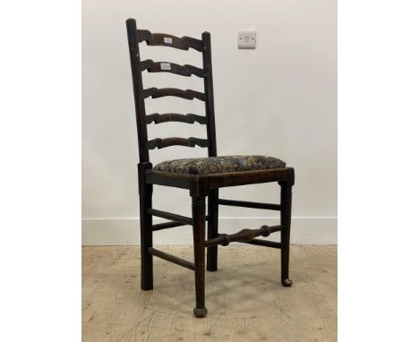 A late 19th century stained oak ladder back chair with drop in seat pad, raised on turned supports with pad feet H100cm