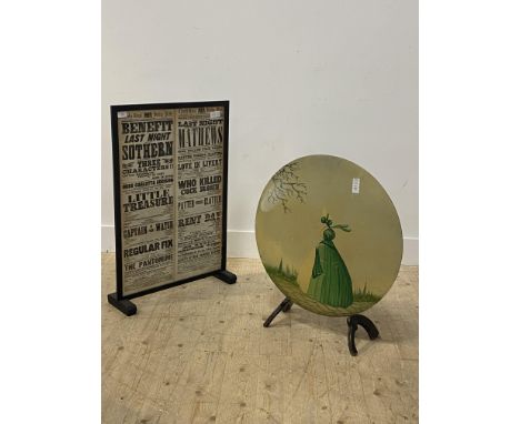 A glazed ebonised fire screen, inset with old newspaper clippings, (H69cm) together with another fire screen (H83cm)