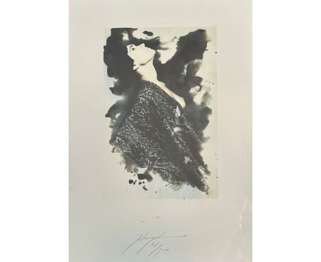 Signed indistinctly, a woman with a eastern style robe, lithographic print 36?/300 signed in pencil in a silver glazed frame.
