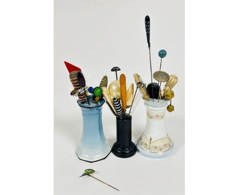 A collection of Vintage hat pins including a Lotus flower enamel pin (L x 8cm), hardstone pins, paste and glass set pins etc 