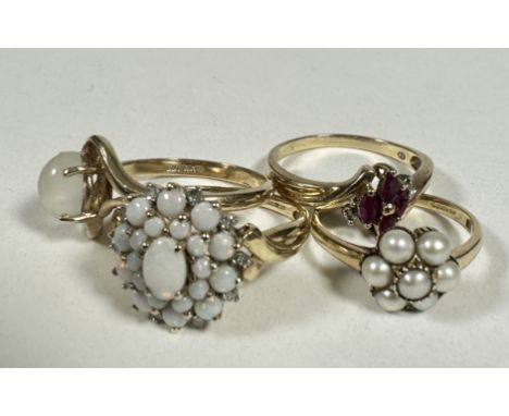 A 9ct gold water Opal QVC cluster ring, R , a 9ct gold oval cabouchon Moon stone ring, P, a 9ct gold four stone Ruby and Diam