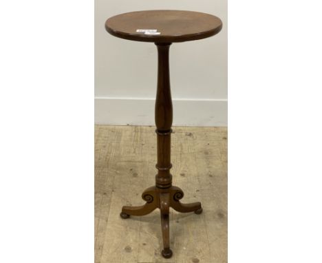 A Victorian oak tripod table, the circular top over a ring turned column and triple splay supports with bun feet H70cm, W32cm