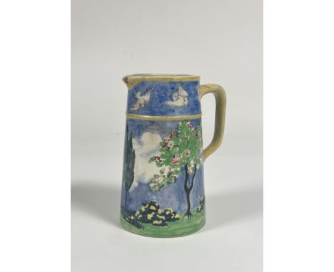 A 1920's ceramic pitcher, handpainted decoration of a landscape scene and white sparrow to rim. (C.R.B.K 1921, possibly celti