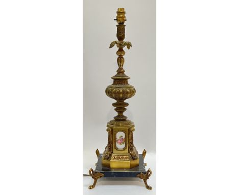 A large Rococo style gilt metal and porcelain lamp on marble base, the porcelain plaques decorated with scenes after Fragonar