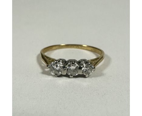 A yellow metal and platinum three stone Diamond ring, the brilliant cut stones approximately o.15ct each, N. 1.77g