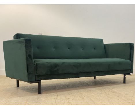 A Contemporary green crushed velvet upholstered three seat sofa bed, standing on black aluminium supports H84cm, W216cm, D86c