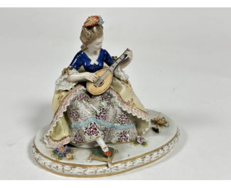 A Capo di Monte porcelain figure " The lute Player " decorated with polychrome enamels, losses to finger and signs of a missi