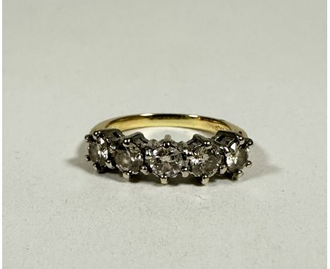 A 18ct gold five stone Diamond ring mounted in white metal claw setting, approximately 1.5ct in total, I. 3.38g