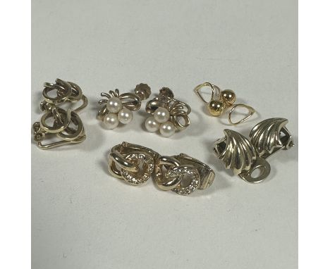 A group of four 9ct gold clip and screw on earrings including cultures pearl ribbon earrings, a pair of knot earrings, a pair