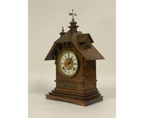 A late 19th century American mantel clock by Ansonia, the gilt brass mounted walnut case of architectural form enclosing a wh