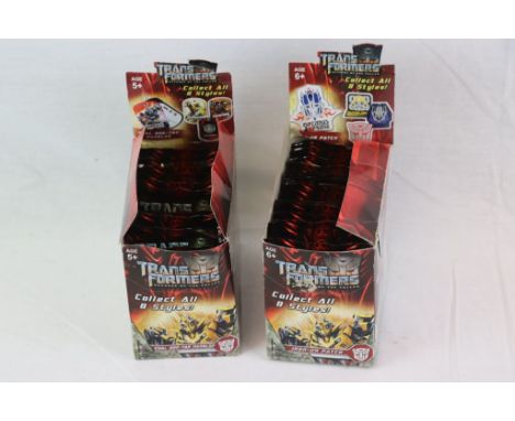 Transformers - Revenge Of The Fallen - 23 unopened Dual Dog-Tag Dangler packs &amp; 37 unopened Iron-On Patch packs, in two o
