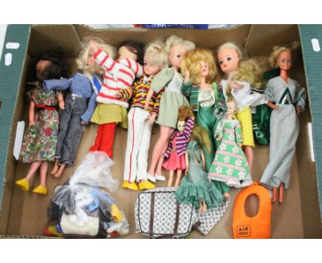 Eight vintage Sindy dolls form the 1960s onwards plus 3 x Pippa dolls and a quantity of clothing and accessories 