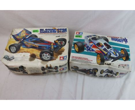 Two boxed 1/10th scale Tamiya remote control cars to include Fighter Buggy RX off road car with remote control and Blazing St