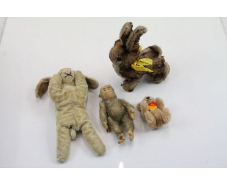 Four soft toy animals to include vintage Steiff monkey and contemporary Steiff bear