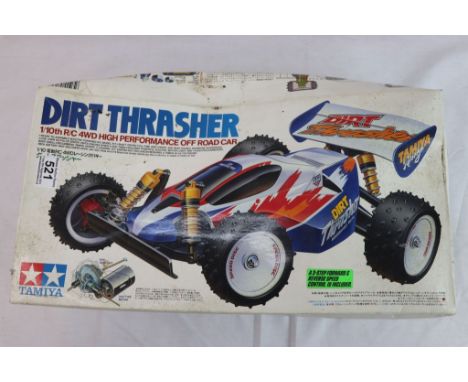 Tamiya Dirt Thrasher 1/10th scale remote control 4WD high performance off road car complete with remote control and original 