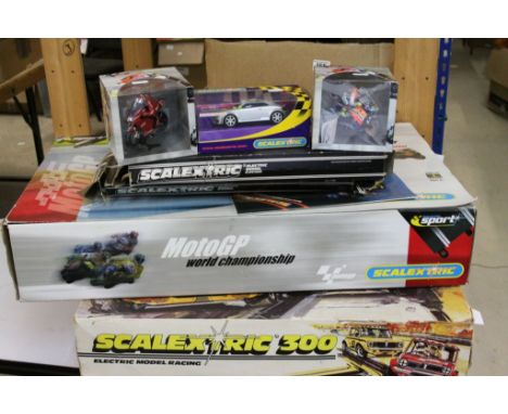 Quantity of boxed Scalextric to include Scalextric 300, Moto GP World Championship, 2 x slot bikes and slot car, track etc 