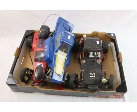 Three 1/10th scale remote control Dune Buggy style off road racing cars to include Tamiya.