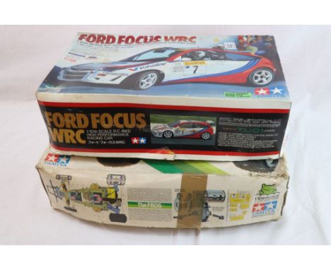 Three Tamiya remote control cars to include a boxed 1/10th scale Ford Focus WRC 4WD high performance racing car and Two The F