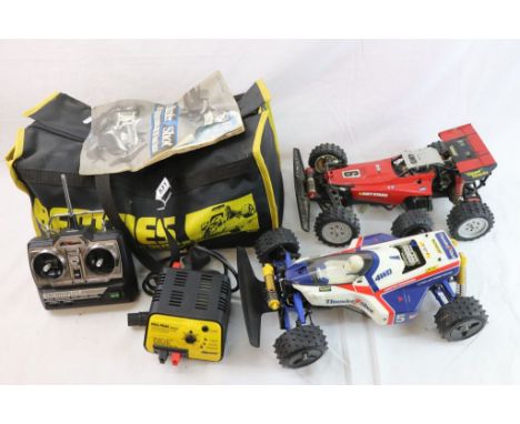 Two Tamiya 1/10th scale remote control cars to include a Thunder Shot 4WD off road racer together with remote control and bat