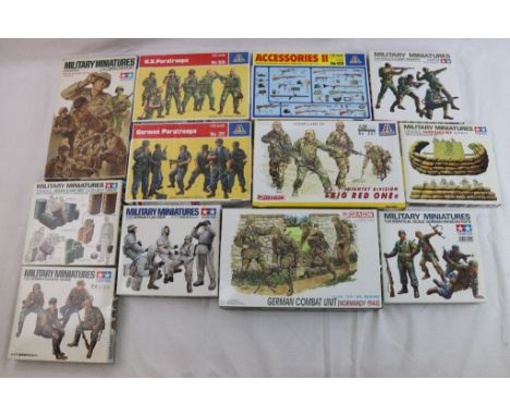 12 boxed Military model kits to include 7 x Tamiya 1:35 featuring No.180 Us Combat group, No.126 Jerry Cans, 35109 German Sol
