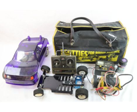 A 1/10th scale petrol remote control car complete with spare chassis, MFA Power panel and remote control.