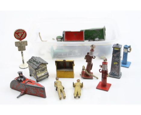 Group of vintage Dinky diecast roadside model accessories and figures to include petrol pumps, signs, etc