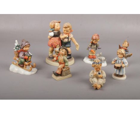 Seven Goebel ceramic figures, Ride into Christmas Hum 396, Little Hiker Hum 16 examples  Good condition.