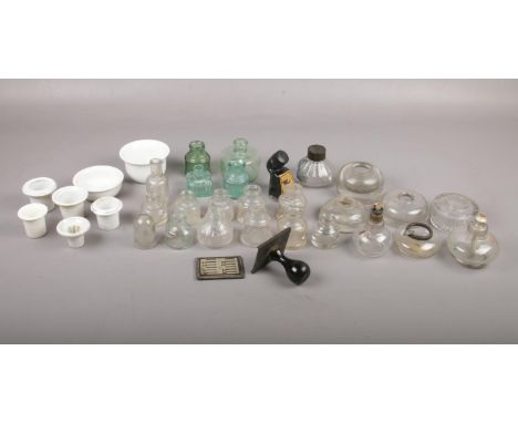 A selection of mostly glass inkwells and bottles, comprising of, a glass ink bottle with Parker Quink top, a selection of sto