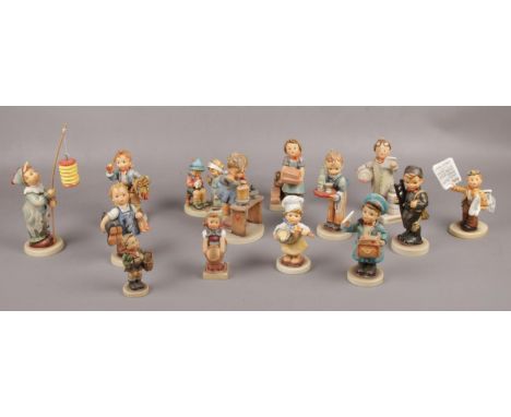 A collection of Goebel ceramic figures, Waiter Hum 154, The Artist Hum 304, Little Pharmacist Hum 322, A Fair Measure Hum 345