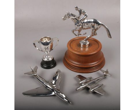 A silver plated horse racing trophy on oak plinth, along with a small silver plated twin handled cup and two metal models of 