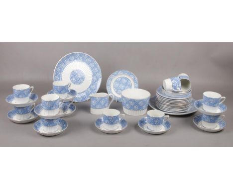 A Early 20th Century blue &amp; white tea set with gilt borders,  cups/saucers, tea plates, milk jug etc  