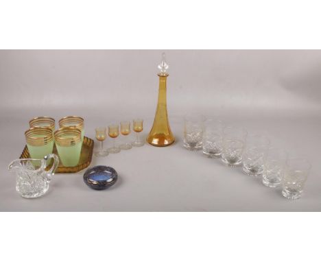 A selection of glassware to include, an amber coloured decanter together with four port/sherry glasses, six cut glass tumbler