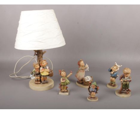 Five Goebel ceramic figures, Boy with Toothache Hum 217, Little Tailor Hum 308, Wash Day Hum 321 examples to include Table La