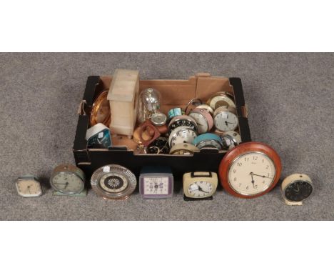 An assorted box of clocks to include, Three "Smith" alarm clocks, an Acctim wall clock and travel alarm clock etc.  
