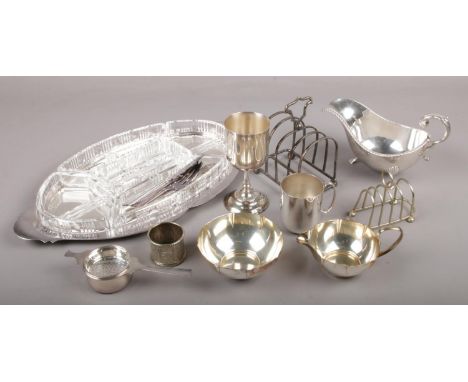 A collection of silver plate, to include hors d'oeuvres set, Prima sugar bowl and cream jug, toast racks etc.  