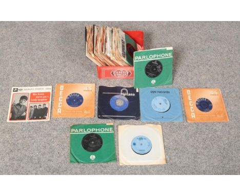 A selection of mostly 60's vinyl singles comprising of, The Rolling Stones, The Beatles, Bob Dylan, The Doors &amp; Simon &am