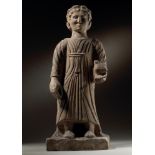 A CARVED LIMESTONE STANDING MALE FIGURE, CYPRIOT, 4TH CENTURY B.C.