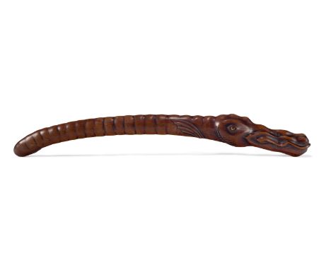 A FRUITWOOD MEDICINE STICK  CHINESE, 19TH CENTURY  Carved in the form of a dragon head with long scaled neck  22cm long    