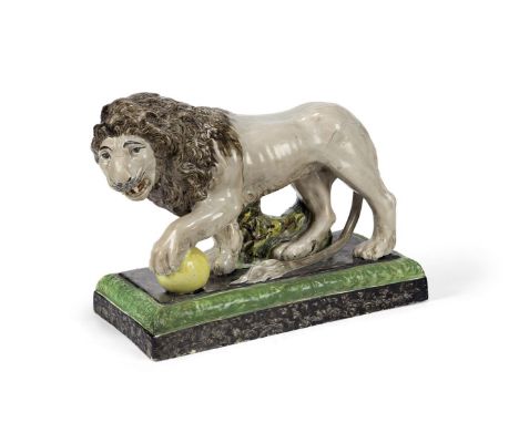 A STAFFORDSHIRE PEARLWARE MODEL OF THE MEDICI LION  CIRCA 1810  21cm high, base 27cm by 13cm   Condition Report:  With wear, 